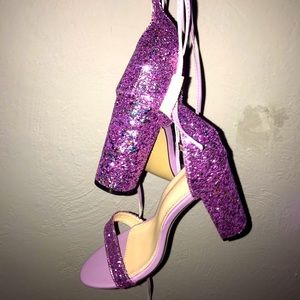 Strappy, purple glitter open toed heels.